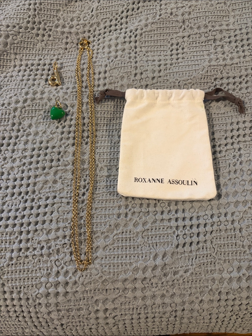 Roxanne Assoulin gold necklace with initial and heart charm